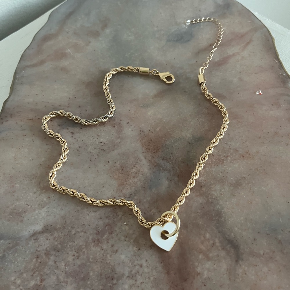 Gold necklace with heart pendant